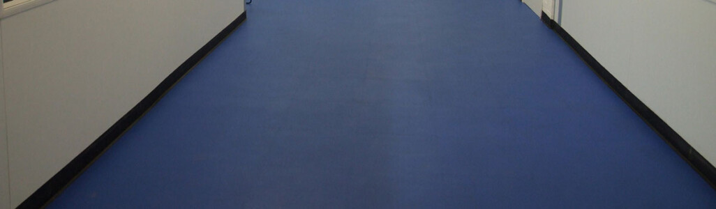 Blue interlocking floor tiles used in an office